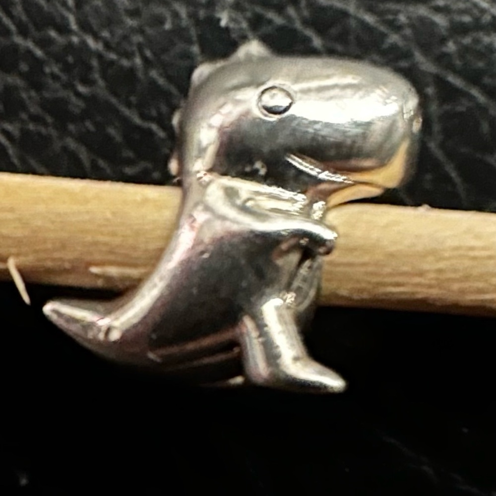 Authentic Pandora “Dino the Dinosaur” retired charm.